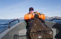 Fisherman holding the tail of a huge fish. horizontal frame