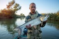 Angler holds big Asp fish Royalty Free Stock Photo