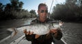 Fisherman holds the Asp fish Royalty Free Stock Photo