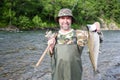 Fisherman holds caught pink salmon. Royalty Free Stock Photo