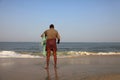 A fisherman holds his fishing net