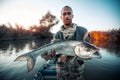 Fisherman holds the trophy Asp fish Royalty Free Stock Photo