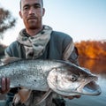 Fisherman holds the trophy Asp fish Royalty Free Stock Photo