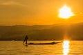 Fisherman with Leg rowing during Sunset, inle lake in Myanmar (