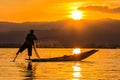 Fisherman with Leg rowing during Sunset, inle lake in Myanmar (