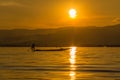 Fisherman with Leg rowing during Sunset, inle lake in Myanmar (