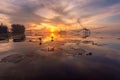 Fisherman on the longtail boat in the morning and giant square dip net at Pakpra village, Phatthalung, Thailand