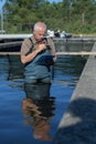 Fisherman man fixing fish net Royalty Free Stock Photo