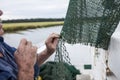 Fisherman mending nets