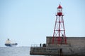 Fisherman near lighthouse pier Royalty Free Stock Photo