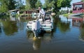 Fisherman and an old fishing boat. Boats on the banks of the Dnieper River