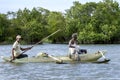 Fisherman paddle their outrigger canoe across Pottuvil Lagoon.