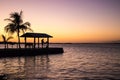 Fisherman on the pier at sunset Royalty Free Stock Photo