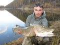 Fisherman with pike Royalty Free Stock Photo
