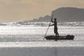 Fisherman Poling at Sunrise