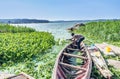 Fisherman poors out water from a boat on Lake Victoria near M Royalty Free Stock Photo
