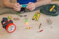 Fisherman prepare to fishing. Tools and accessories on wooden table Royalty Free Stock Photo