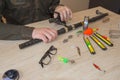 Fisherman prepare to fishing. Tools and accessories on wooden table Royalty Free Stock Photo