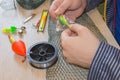 Fisherman prepare to fishing. Tools and accessories on wooden table Royalty Free Stock Photo