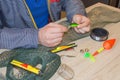 Fisherman prepare to fishing. Tools and accessories on wooden table Royalty Free Stock Photo