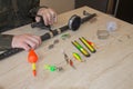 Fisherman prepare to fishing. Tools and accessories on wooden table Royalty Free Stock Photo