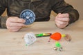 Fisherman prepare to fishing. Tools and accessories on wooden table Royalty Free Stock Photo