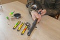 Fisherman prepare to fishing. Tools and accessories on wooden table Royalty Free Stock Photo