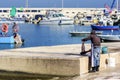 Fisherman prepares octopus