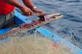 Fisherman preparing bait