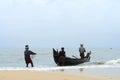 Fisherman pulls his fishing boat Royalty Free Stock Photo