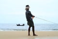 Fisherman pulls his fishing boat