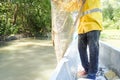 Fisherman readies his fishing net early in the morning