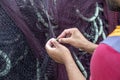 Fisherman repairing fishing nets 2