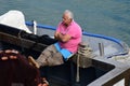 Fisherman Resting on Boat at Porto Mirabello, La Spezia, Liguria, Italy