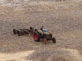 Fisherman reversing his tractor