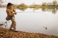 Fisherman on the river bank