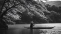 fisherman on the river black and white photo Boatman punting the boat at river. autumn season along the river