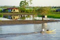 Fisherman on a rowboat on Amazon river. Royalty Free Stock Photo