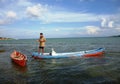 Fisherman rowing a sampan boat