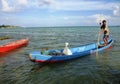 Fisherman rowing a sampan boat Royalty Free Stock Photo