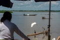 View of a fisherman`s boat with a person on the banks of the Magdalena River. Colombia.