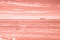 Fisherman's boat in open sea waters at morning to sunrise Royalty Free Stock Photo