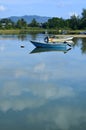 Fisherman's boat in a tranquil bay Royalty Free Stock Photo