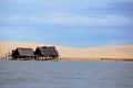 Fisherman`s hut along the river. Poor and precarious housing. Royalty Free Stock Photo