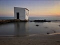 FishermanÃÂ´s hut at sunset in the beach Royalty Free Stock Photo