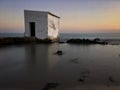 FishermanÃÂ´s hut at sunset in the beach Royalty Free Stock Photo