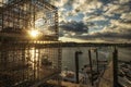 Fisherman`s pier on the bay at sunset. Lobster traps on a wooden pier and boats . USA. Maine.