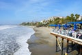 Fisherman`s restaurant on San Clemente Pier with beach and coastline on background.