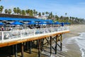 Fisherman`s restaurant on San Clemente Pier with beach and coastline on background.