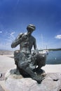 Fisherman's statue in Njivice harbour on island Krk